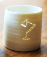 Load image into Gallery viewer, Ceramic candle holder, made from porcelain, for tealights. With a classic midcentury lamp as the motif, the candlelight shines through the tiny holes.