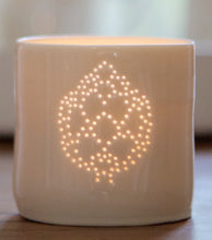 Load image into Gallery viewer, Ceramic porcelain tealight candle holder, featuring a design of an artichoke, pierced into the tealight holder with little holes. Foodie gift.