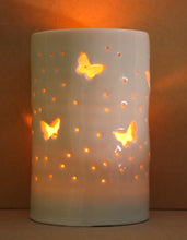 Load image into Gallery viewer, Porcelain tealight holder with butterfly design. Ceramic candle holder which glows from within.