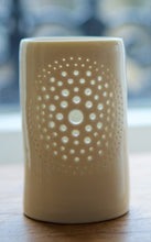 Load image into Gallery viewer, A natural porcelain ceramic tealight candle holder, with a floral design, resembling a large flower, like a dandelion. Homeware and garden decoration. Porcelain tableware. Natural glossy glaze.