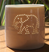 Load image into Gallery viewer, Tropical present. This porcelain ceramic tealight candle holder features a design of an elephant, pierced with tiny holes. Safari present.