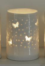 Load image into Gallery viewer, Porcelain tealight holder with butterfly design. Ceramic candle holder which glows from within.