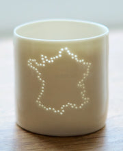 Load image into Gallery viewer, Francophiles delight - this ceramic tealight candle holder features the outline of France. Glazed with a natural gloss, the light shines from within. French present. Continental Europe.