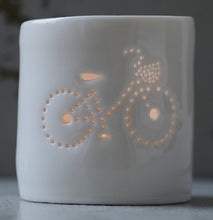 Load image into Gallery viewer, Porcelain ceramic tealight candle holder votive, featuring a design of a bike with a basket. Natural glossy glaze. Bicycle. Cycling gift.