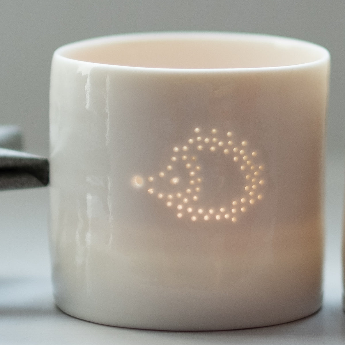 Cute hedgehog design candle holder. Porcelain ceramic tealight holder with adorable hedgehog design.