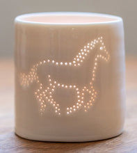 Load image into Gallery viewer, Galloping horse ceramic tealight holder. This porcelain candle holder features an equestrian design, perfect for horse lovers.