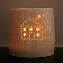 Load image into Gallery viewer, A cute house with smoke emerging from the chimney, pierced into a ceramic porcelain tealight candle holder. This candle votive will create a sense of home, hygge and warmth.