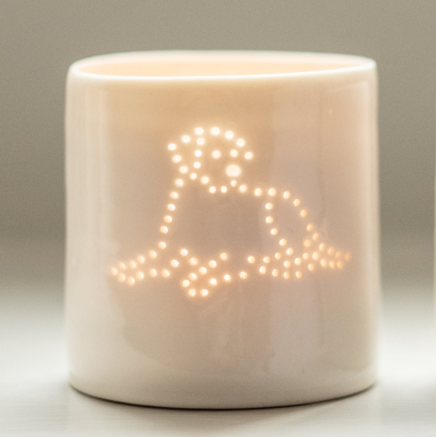 Pet lover present, a porcelain ceramic candle tealight holder featuring an image of a lying down labrador. Simple scandi chic.