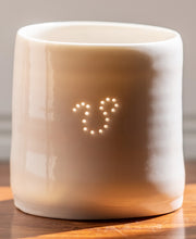 Load image into Gallery viewer, Handmade porcelain tealight holder. This ceramics candle holder has the astrological symbol of Leo pierced into it with tiny holes. Astrology, virgo birthdays, horoscopes, zodiac
