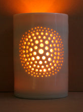 Load image into Gallery viewer, A natural porcelain ceramic tealight candle holder, with a floral design, resembling a large flower, like a dandelion. Homeware and garden decoration. Porcelain tableware. Glowy natural glossy glaze