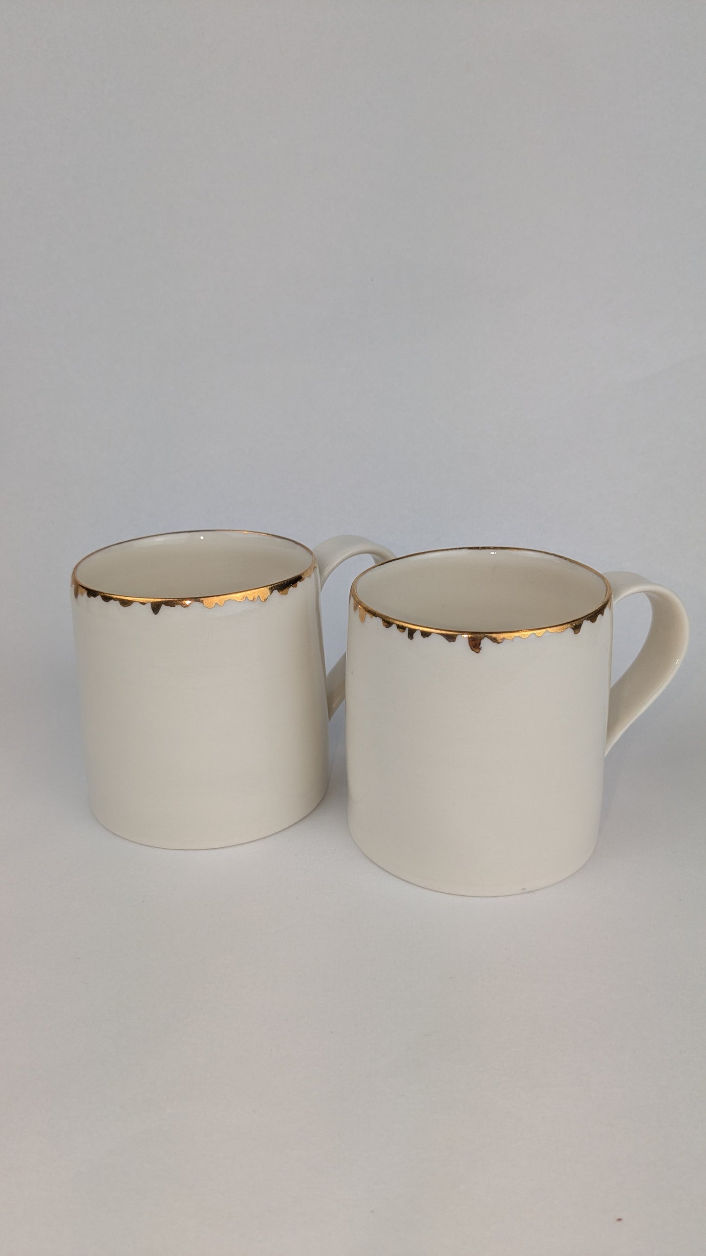Porcelain cup with gold lustre rim