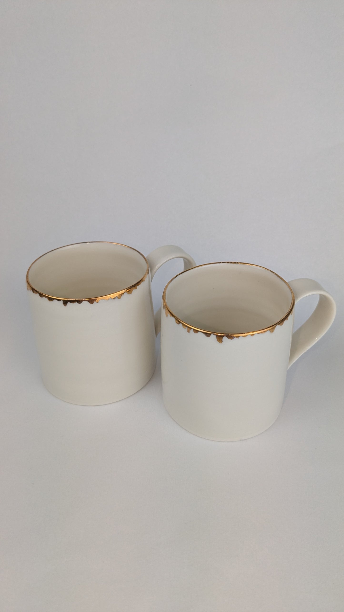 Porcelain cup with gold lustre rim