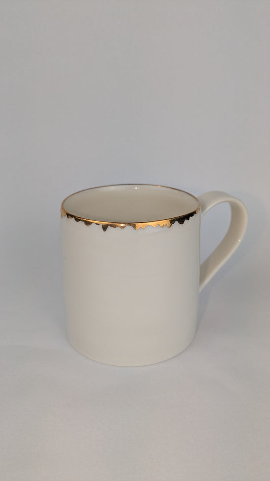 Porcelain cup with gold lustre rim
