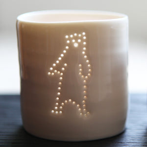 Ceramic porcelain tealight candle holder, votive, natural glossy glaze, and pierced with a standing bear design. Cute gift.