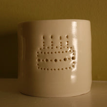 Load image into Gallery viewer, Porcelain ceramic tealight candle holder, featuring a design of a birthday cake with candles, natural glossy glaze. Unlit. Birthday present. Celebration.
