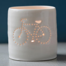 Load image into Gallery viewer, Porcelain ceramic tealight candle holder votive, featuring a design of a bike with a crossbar. Natural glossy glaze. Bicycle. Cycling. Fathers Day.
