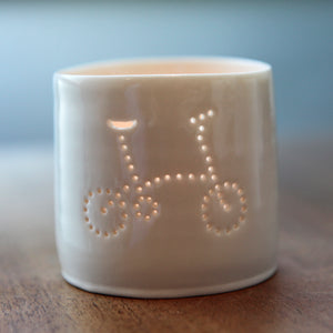 Porcelain ceramic tealight candle holder votive, featuring a design of a folding bike. Natural glossy glaze. Bicycle. Cycling gift. Brompton inspired.