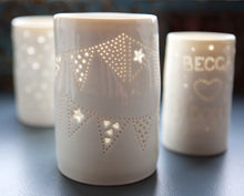 Load image into Gallery viewer, Porcelain ceramic tealight candle holder, with bunting design going all the way round. Hanging garden decoration. Garden party decor. Jubilee gift. Celebration.
