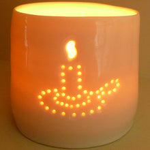 Load image into Gallery viewer, A porcelain ceramic tealight candle holder, votive, with an old fashioned candle holder design pierced into it using tiny holes. Natural glossy glaze. Homeware.
