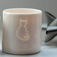 Load image into Gallery viewer, Porcelain ceramic tealight candle holder votive with sitting cat outline design. Natural glossy glaze. Pet lover. Pet gift.
