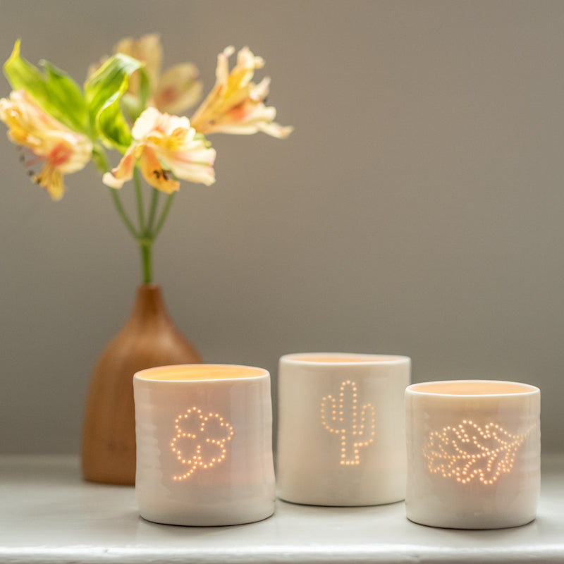 Trio of porcelain tealight candle holders with a cactus, oak leaf and clover design. Outdoor, plant, botanical collection.