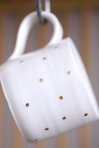 Gold Lustre porcelain cup with small spots