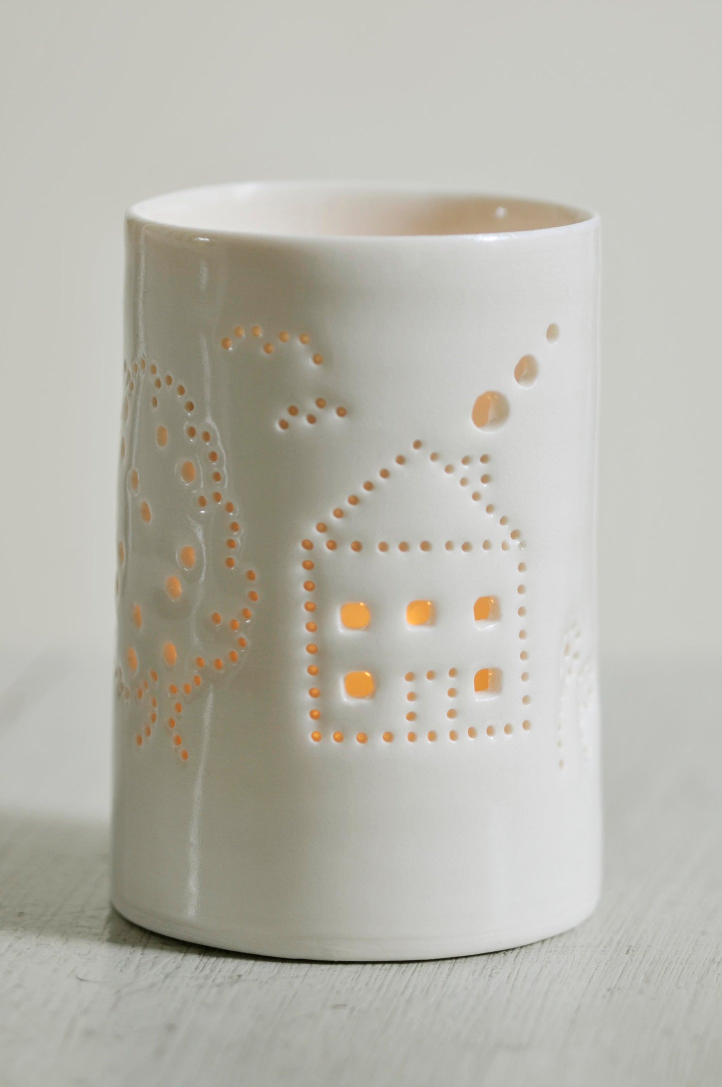 Ceramic tealight holder, with a house and garden design. Perfect for housewarming present, homeware, decoration. Get in the "hygge" mood with this porcelain candle holder.