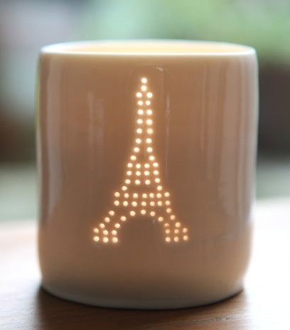 Classic Eiffel Tower design. Porcelain candle holder, this ceramic tealight votive features a classic Paris design.