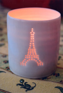 Classic Eiffel Tower design. Porcelain candle holder, this ceramic tealight votive features a classic Paris design.