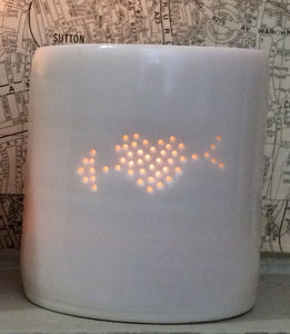 Porcelain ceramic tealight candle holder with a design of an arrow through a filled heart. Valentine's Day gift. Romantic present. Anniversary.