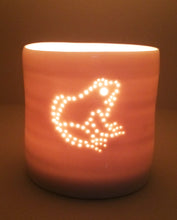 Load image into Gallery viewer, Cute little frog design. Porcelain candle holder with a sitting frog outline in pierced holes. Ceramic tealight holder. Wildlife. Outdoorsy present.
