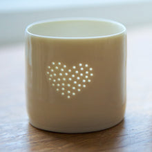 Load image into Gallery viewer, A lovely present this ceramic candle holder is designed with a heart. Porcelain tealight holders as wedding presents, memorials or anniversary gifts.
