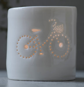 Porcelain ceramic tealight candle holder votive, featuring a design of a bike with a basket. Natural glossy glaze. Bicycle. Cycling gift.