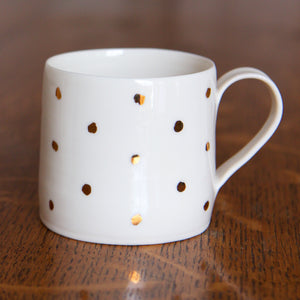 Gold Lustre porcelain cup with small spots