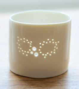 Christmas decoration - porcelain candle holder with a Holly design. The light shines through the holes. Christmas gift, Christmas present.