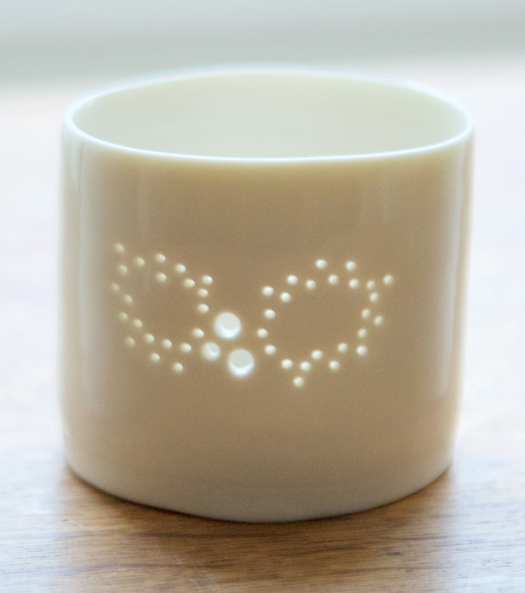 Christmas decoration - porcelain candle holder with a Holly design. The light shines through the holes. Christmas gift, Christmas present.