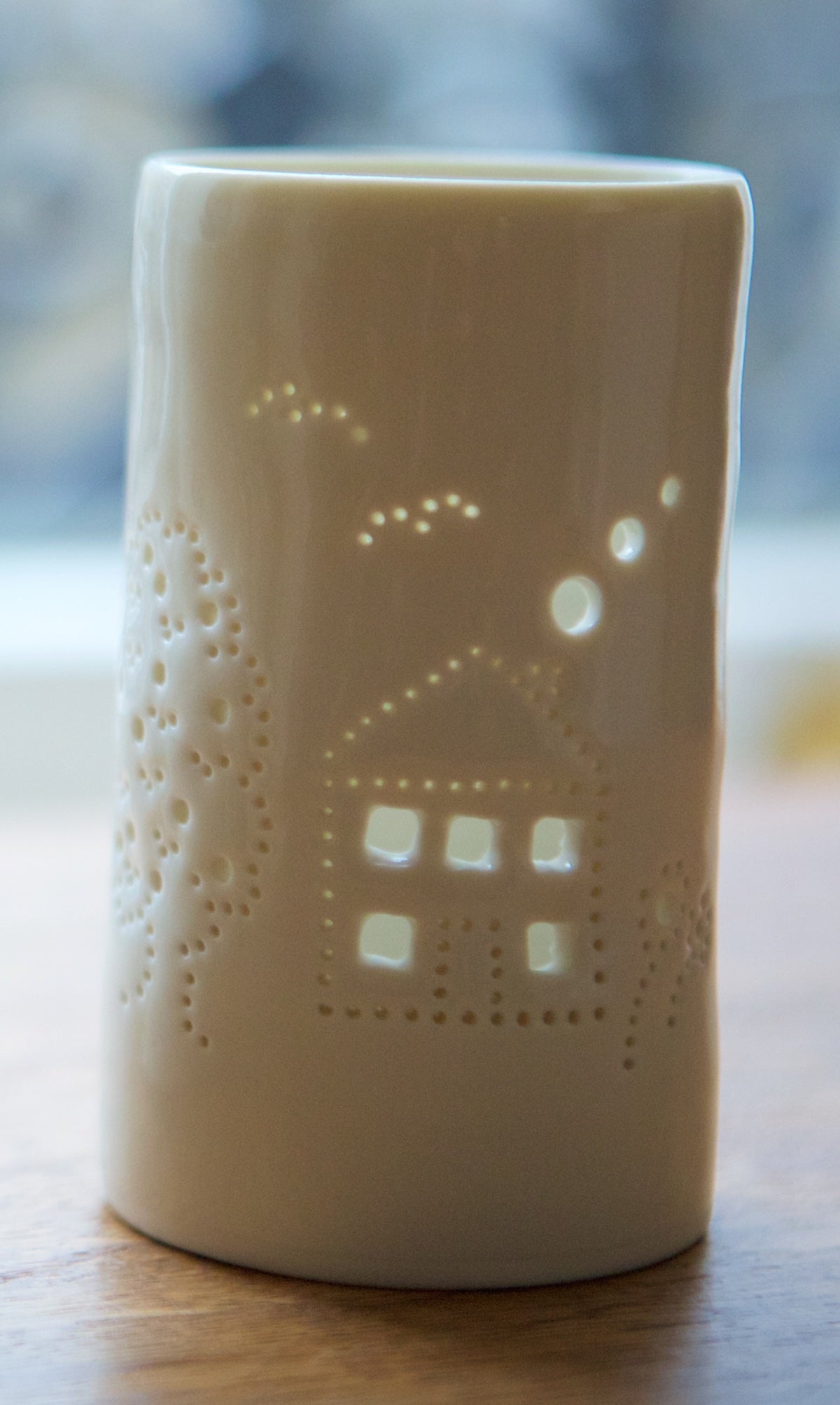 Ceramic tealight holder, with a house and garden design. Perfect for housewarming present, homeware, decoration. Get in the "hygge" mood with this porcelain candle holder.