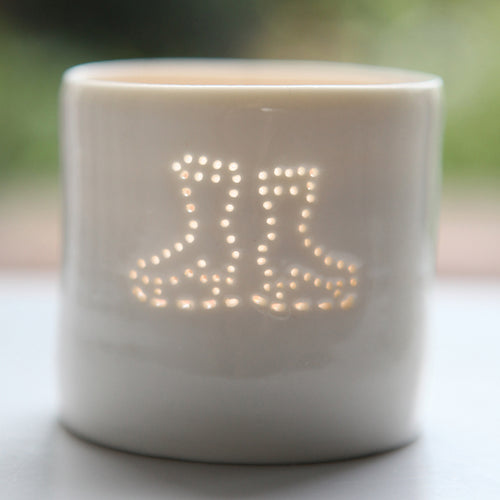 Ice skating, this ceramic porcelain tealight candle holder is a wintery treat. Homeware, Christmas and decoration.