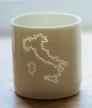 Load image into Gallery viewer, Italy present. Italy country outline on a porcelain candle holder. This ceramic tealight holder evokes European holidays. Handmade. Natural. Roman Holiday. Florence. Venice.
