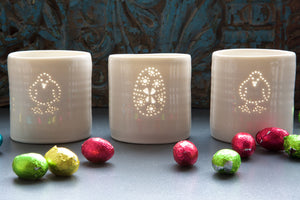 A trio of porcelain ceramic tealight candle holders, with a delicate design of a chick and an Easter Egg. Easter present. Easter gift.