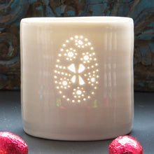 Load image into Gallery viewer, Easter egg candle holder. This porcelain tealight holder has a pierced design of an Easter Egg. Perfect Easter present. 

