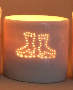 Ice skating, this ceramic porcelain tealight candle holder is a wintery treat. Homeware, Christmas and decoration.