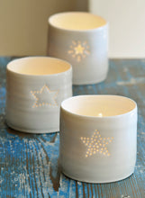 Load image into Gallery viewer, Trio of ceramic candle holders with a star design. Perfect gift for teachers, friends, astrology. Porcelain tealight holders.
