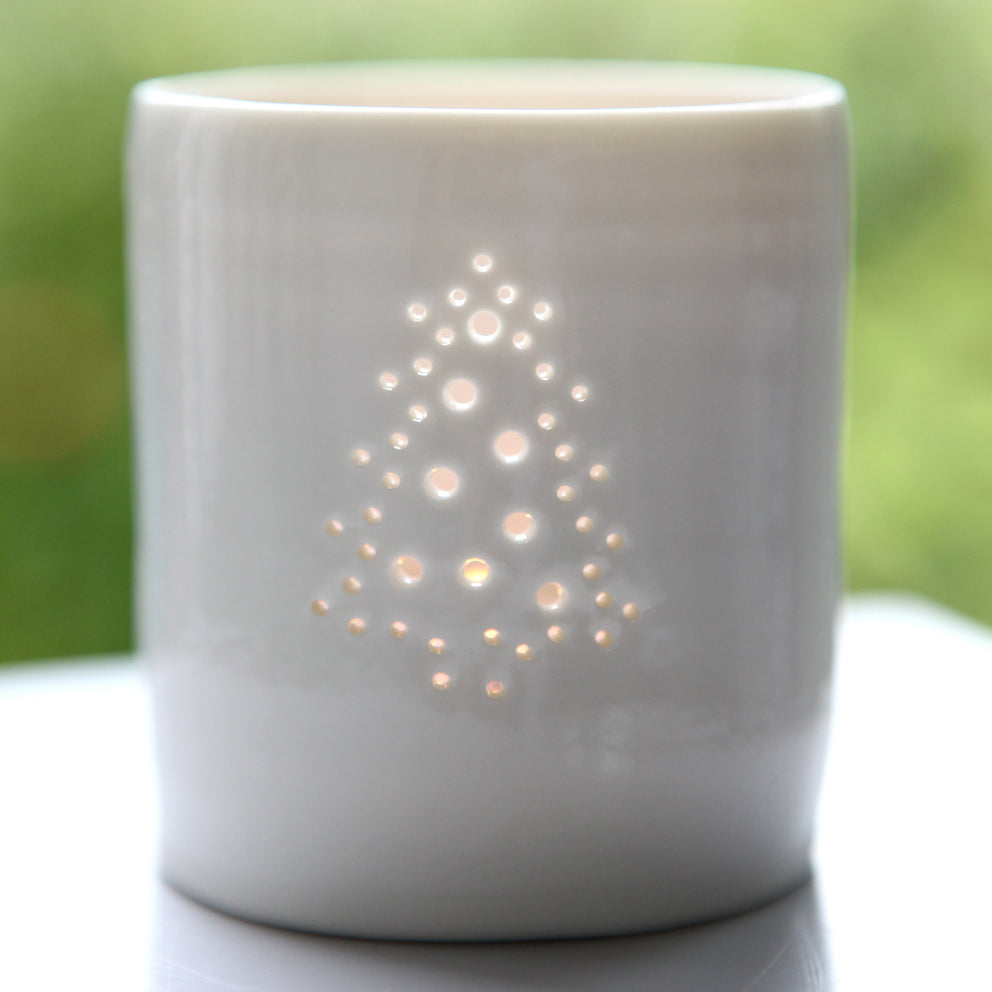 A Christmas tree themed candle holder. Ceramics porcelain tealight candle holder. Christmas gift. Decoration.
